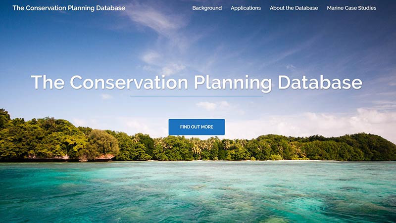 Splash screen for The Conservation Planning Database featuring reef and marine environment, with blue sky and clear aqua water