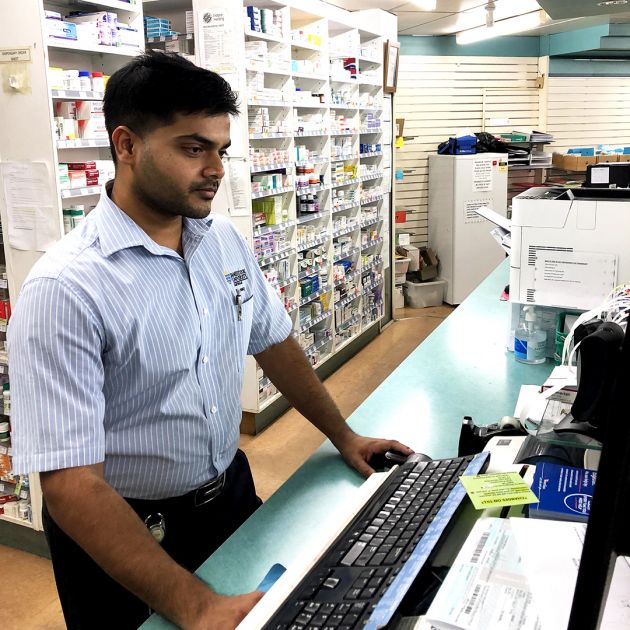 Pharmacist at counter