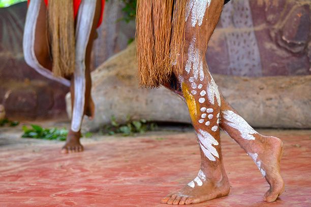 Australian Aboriginal men dancing during a local culture ceremony festival event in the tropical far north of Queensland, Australia