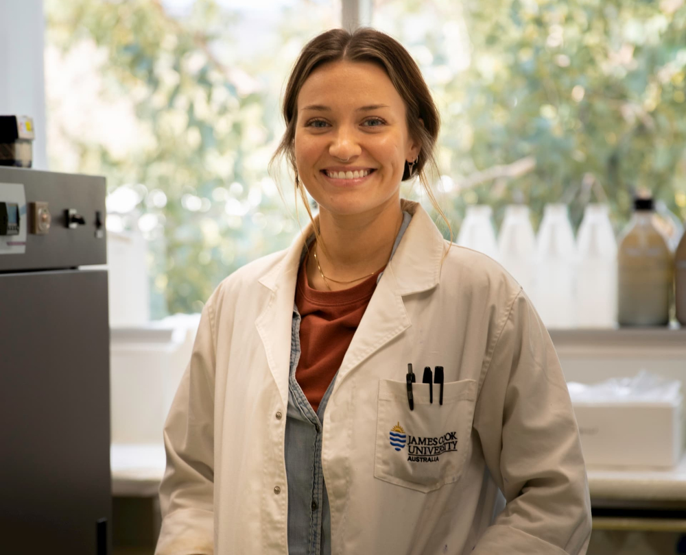 Madeline McKenzie in lab coat. 