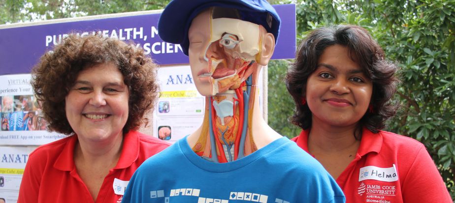 two staff members with an anatomical model
