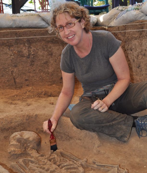 Kate Dommet uncovering a human skeleton at an archaeological dig