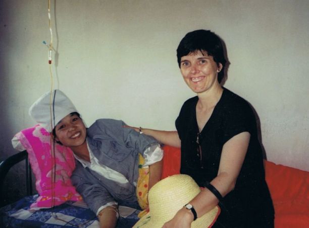 Maxine Whittaker with a surgery patient in China
