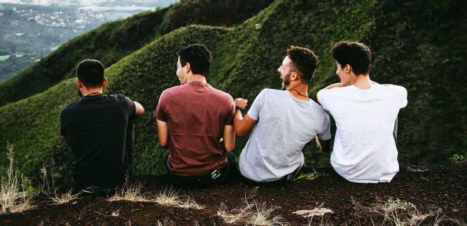 Four men together on a mountain 