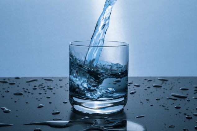 Water being poured into a clear glass