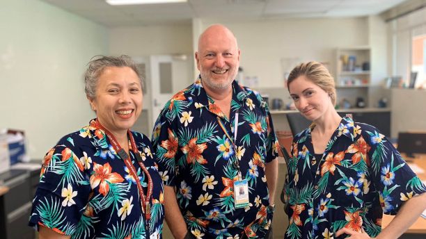 Staff with Tahnee Bridson wearing tropical shirts for mental wellbeing