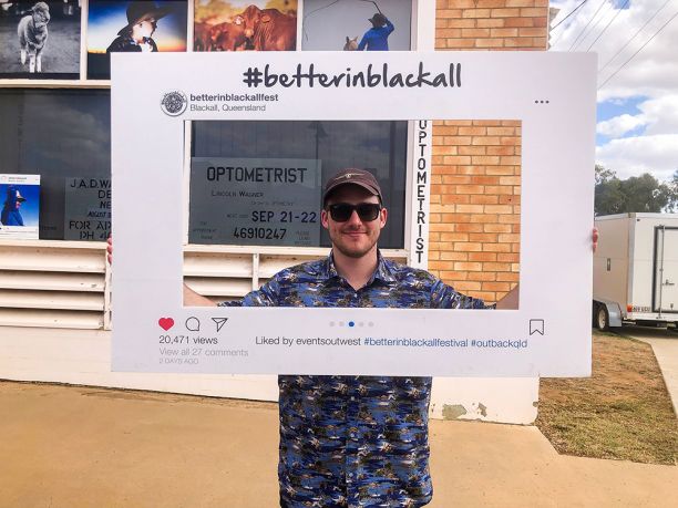 Man with instagram frame saying Better in Blackall Festival