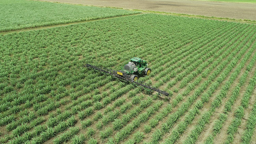 Image of field with tractor from above. 