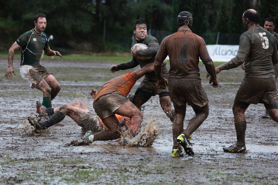 Mud-covered Rugby League players