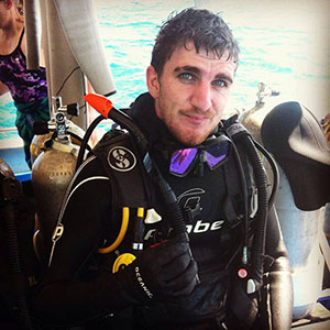 Michael Grant dressed in dive equipment