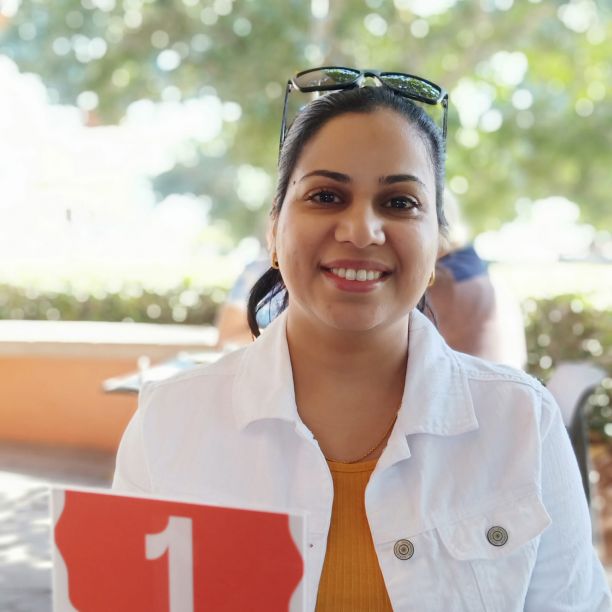 JCU PhD Candidate Swapna Chaudhary smiling and wearing a white jacket. 