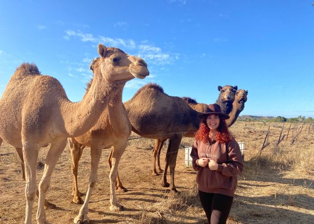 Chloe with camels on placement in Mount Isa 