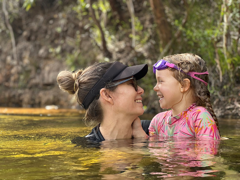 Dr Riley Savage and daughter Molly swimming at Elliot Falls