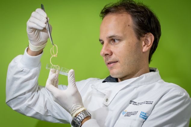 Paul Giacomin with parasitic worms in a petri dish