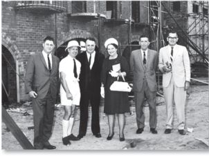 (L to R) Robert “Duke” Bonnett MHR, Dr Colin Roderick, H.T. Priestley, Dame Annabel Rankin, George Roberts and Ken Back, 1966. University Hall under construction can be seen in the background. (National Archives of Australia: M2127, 5)