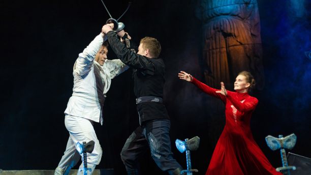 Actors perform a swordfight in a Shakespeare play