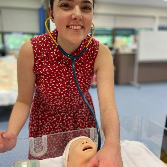 Samantha practising her work with an infant simulation mannequin. 