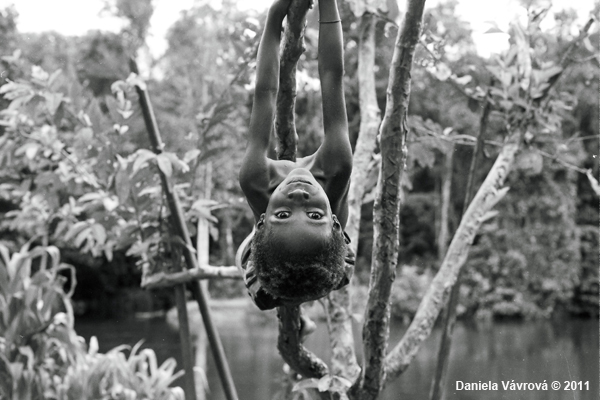 Child hanging from a tree. 