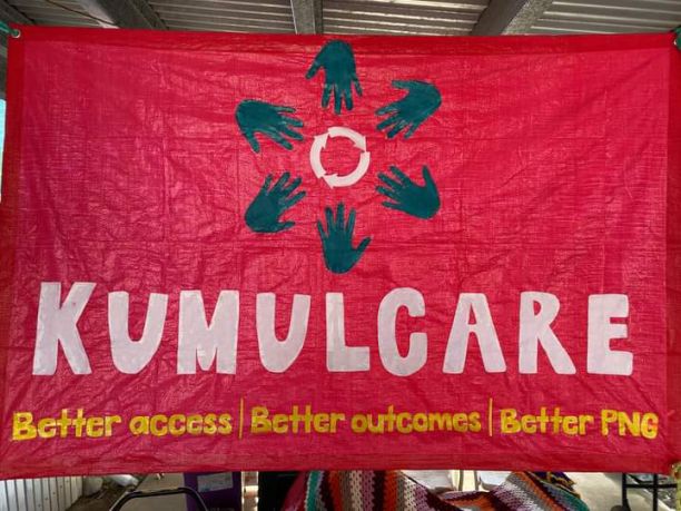 Red banner for KumulCare that has six hands arranged in a circle. It says KumulCare: Better access, better outcomes, better PNG