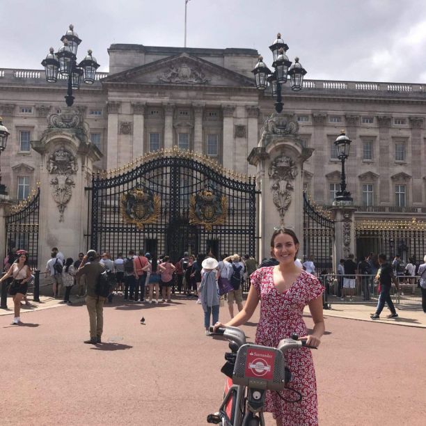 Lily Aboud in front of Buckingham Palace