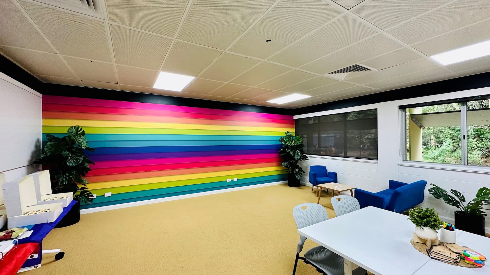 Rainbow wall in a lounge room. 