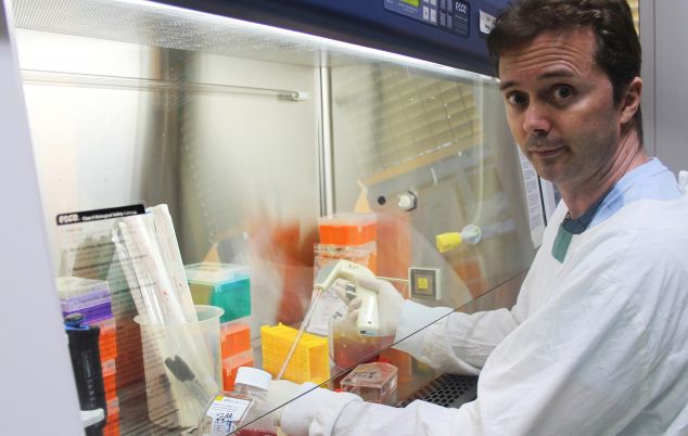 Dr Michael Smout working in his lab