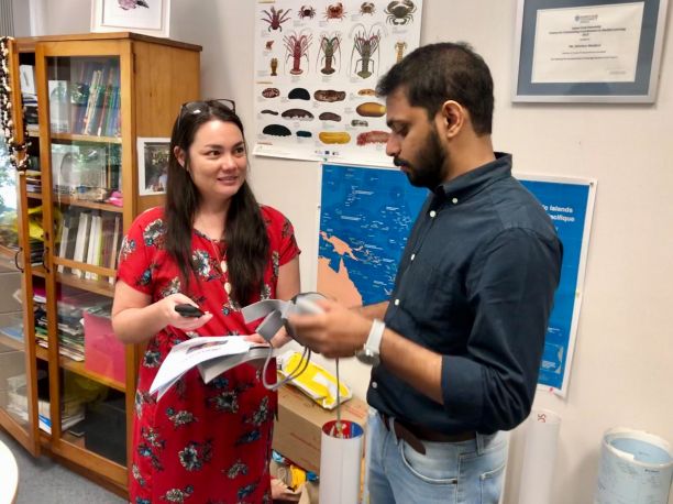 Florence Boulard with a J.C.U. Master's student discussing 360 degree application for French language class.