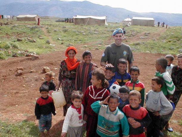 Dr Bob Worswick with a group of children in Lebanon