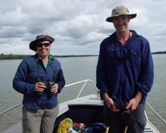 Two JCU researchers on a small boat in Papua New Guinea. 