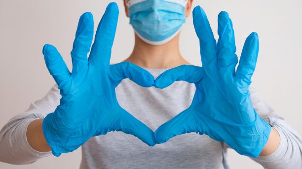 Doctor making heart shape with hands