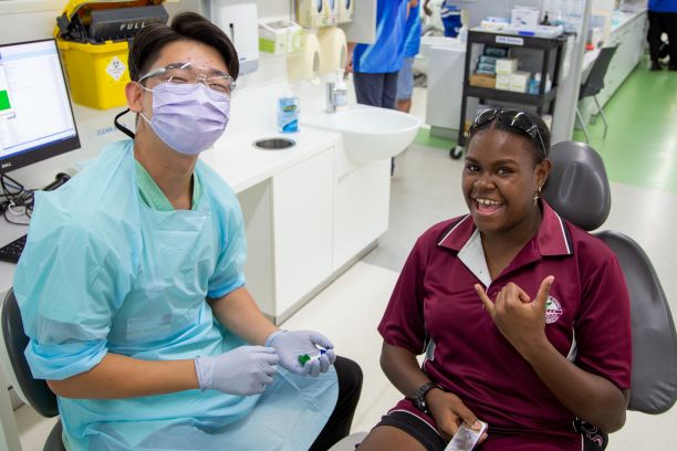 JCU Dentistry student with AFL Cape York House student