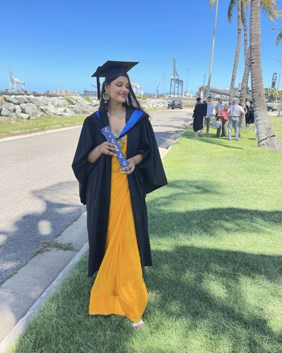 Student Medha Chaturvedi wearing a graduation gown