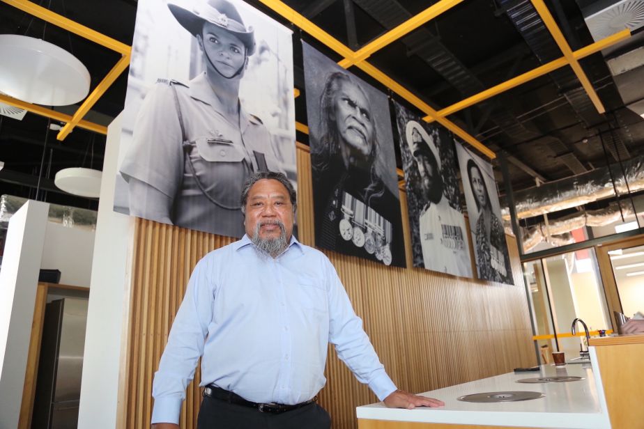 James Cook University Deputy Vice Chancellor, Indigenous Education and Strategy, Professor Martin Nakata, with some of the banners on display as part of the Serving Country exhibition at JCU’s Indigenous Education and Research Centre.