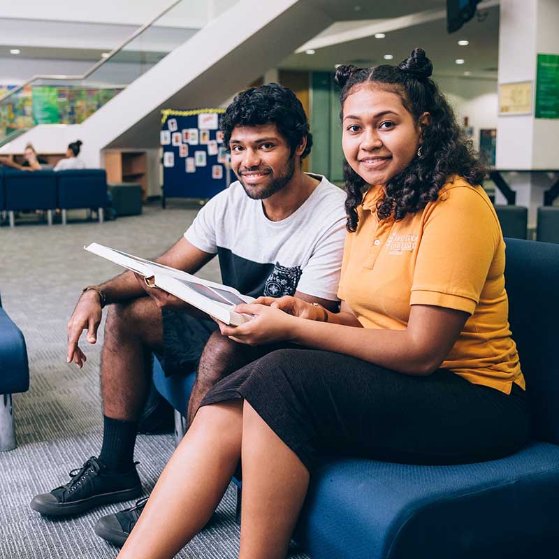 Two students in a library