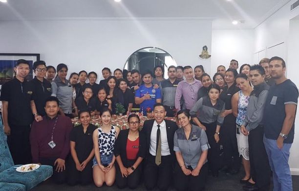 James with about 30 of his employees from the housekeeping department at Meriton Suites World Tower in Sydney. 