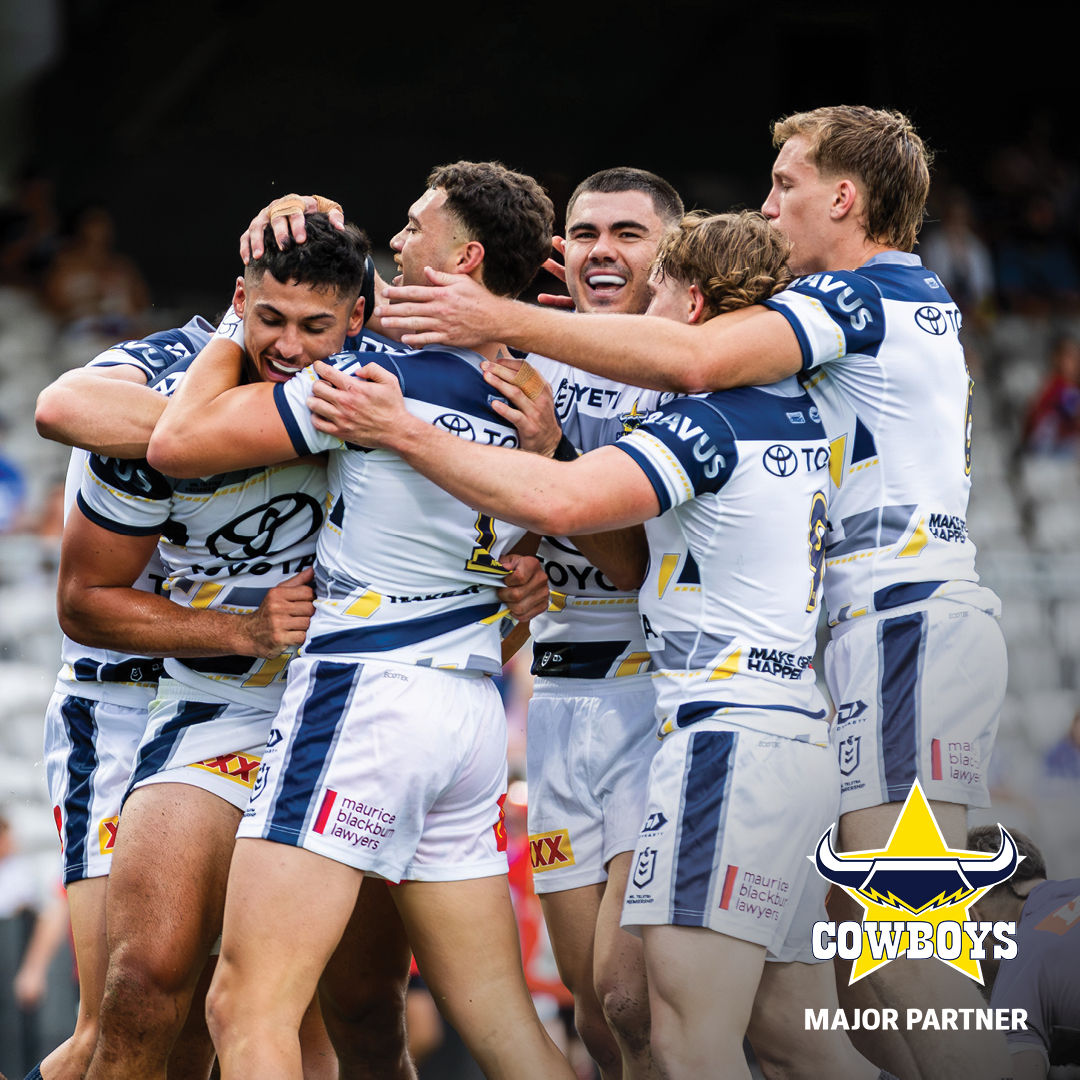 Cowboy players celebrating a try. 