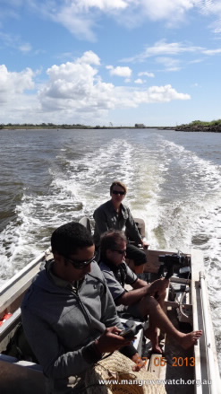 film crew in boat. 