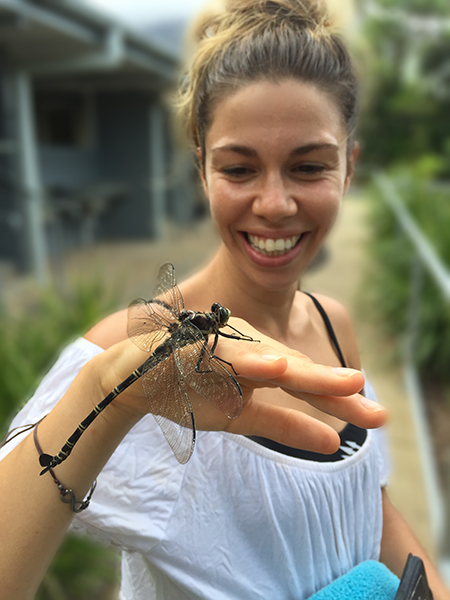Student with pettle-tail dragonfly