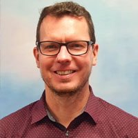 Headshot of Associate Professor Ulf Schmitz. 