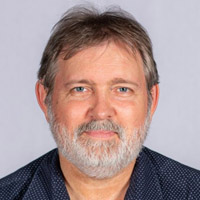 A head shot of Andrew Higgins. 