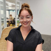 Business and Law Student, Ella Hall, in a classroom. 