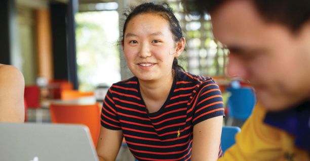 Student working with a laptop