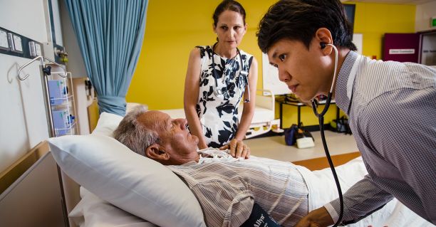 Teacher observing a patient