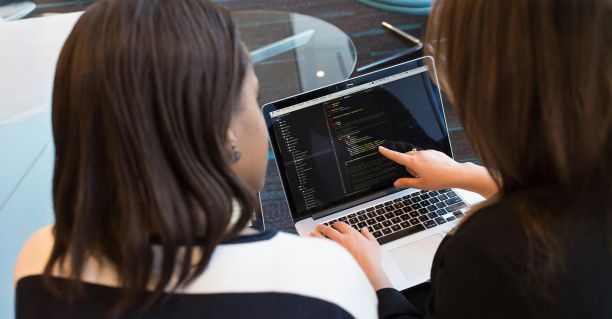 People working at a computer 