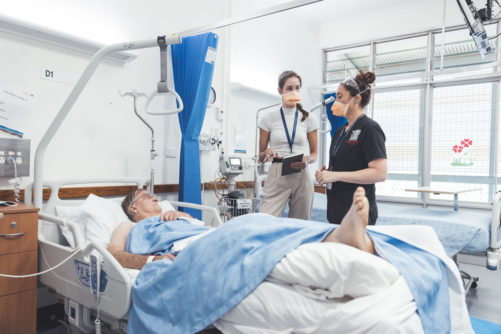 Dr Emma Gilmore and medical student Audrey Anwyl treating a patient at Cloncurry Hospital
