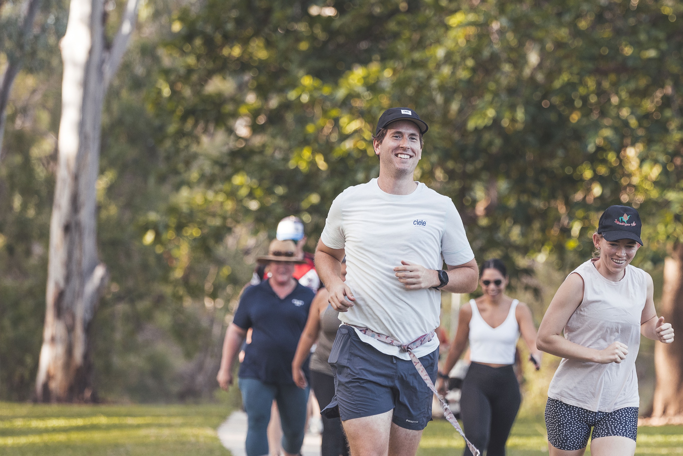 Couple with dog running in the park