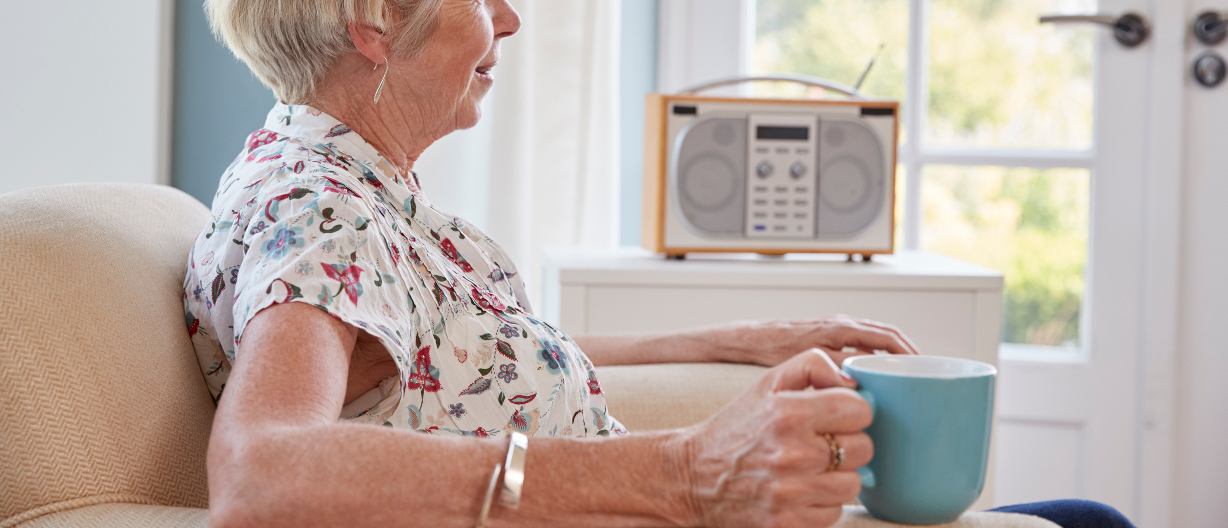Senior listening to the radio
