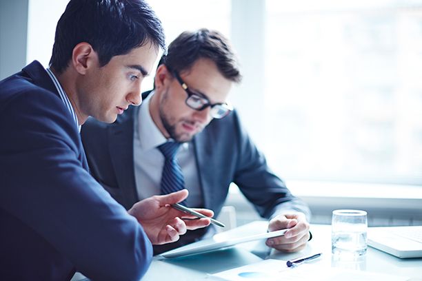 Business person explaining data to colleague