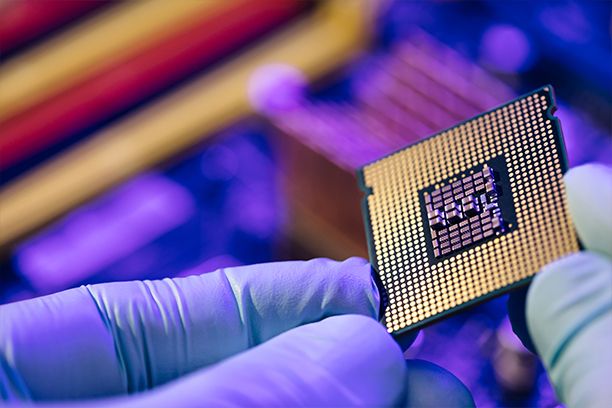 Computer support engineer installing processor