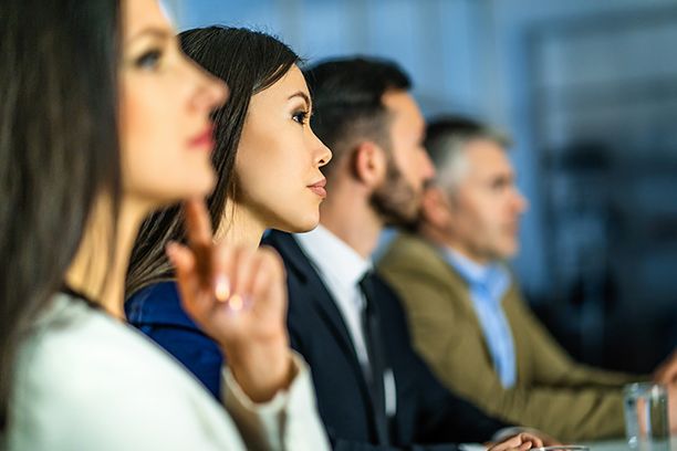 People listening intently in a meeting 
